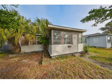 Charming bungalow home with a sunroom and landscaped yard at 2045 18Th S Ave, St Petersburg, FL 33712