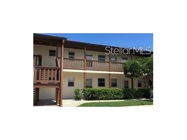 Two-story building with balconies and landscaping at 5135 Gemstone Dr # 206, New Port Richey, FL 34652