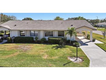 Single-story home with a paved driveway and well-maintained lawn at 2122 Hereford Dr # 511, Sun City Center, FL 33573