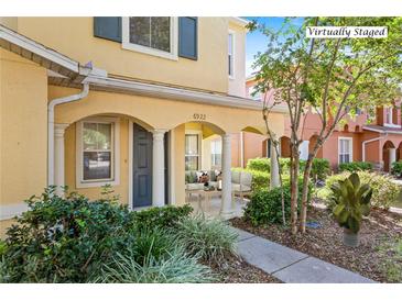 Inviting front porch with columns and landscaping at 6922 Hawthorne Trace Ln, Riverview, FL 33578