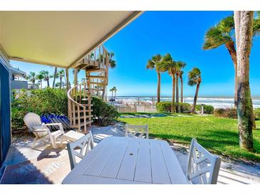 Spiral staircase to backyard patio with ocean views at 2100 Gulf Blvd # 13, Belleair Beach, FL 33786