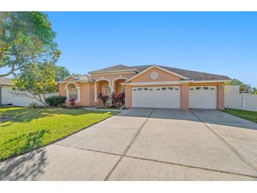 Attractive one-story house with a three-car garage and well-maintained lawn at 9122 65Th N Way, Pinellas Park, FL 33782