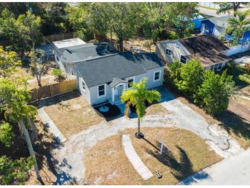 Aerial view of a charming house with a well-manicured lawn and driveway at 3534 6Th S Ave, St Petersburg, FL 33711