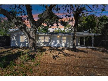 Updated single-story home with a covered carport and mature landscaping at 2412 38Th W Ave, Bradenton, FL 34205