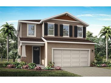 Two-story home with neutral siding, shutters, and a two-car garage at 31210 Pendleton Landing Cir, Wesley Chapel, FL 33545