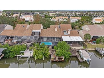 Aerial view of waterfront property with private pool and boat dock at 4111 Starfish Ln # 6, Tampa, FL 33615