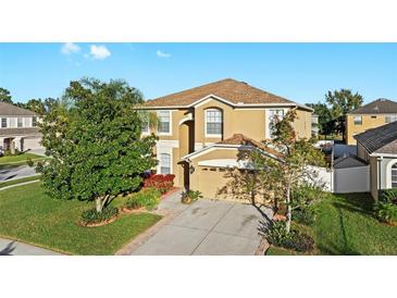 Exterior view of a two story house with a two car garage at 7860 Atwood Dr, Wesley Chapel, FL 33545