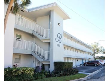 Two-story building with parking and landscaping at 9950 47Th N Ave # 104, St Petersburg, FL 33708
