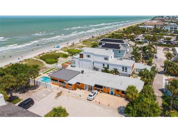 Aerial view of beach house with pool, and ocean at 1600 Beach Trl, Indian Rocks Beach, FL 33785