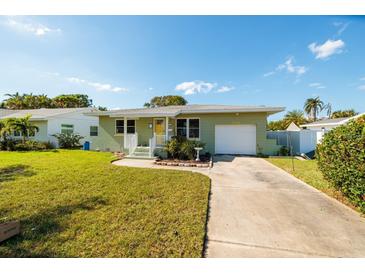 Charming ranch home with a spacious yard and attached garage at 3738 Bayshore Ne Blvd, St Petersburg, FL 33703