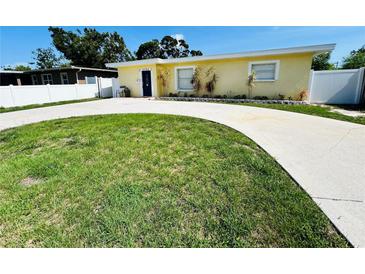Charming single-story home with a well-manicured lawn and a curved driveway at 6366 38Th N Ave, St Petersburg, FL 33710