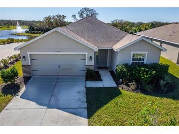 One-story home with a two-car garage and landscaped lawn at 16207 59Th E Ct, Parrish, FL 34219