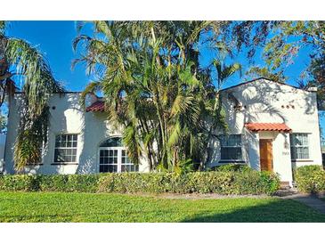 Charming Spanish-style home with lush landscaping and a spacious lawn at 7001 Bethel S Way, St Petersburg, FL 33712