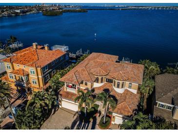 Luxury waterfront home with expansive bay views, two-car garage, and a large patio at 308 Harbor Dr, Indian Rocks Beach, FL 33785