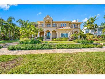Mediterranean-style home featuring lush landscaping, a red tile roof, and a stately facade at 1925 Beach Se Dr, St Petersburg, FL 33705