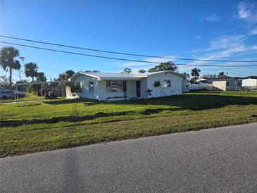 Ranch-style home with a spacious yard at 202 7Th Nw St, Ruskin, FL 33570