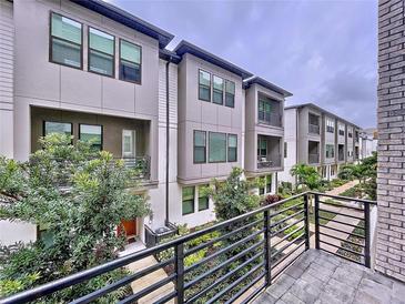 Modern townhouses with private balconies and lush landscaping at 2511 N Grady N Ave # 59, Tampa, FL 33607