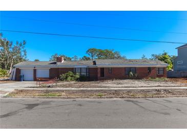 Brick, single-story home with a two-car garage at 2618 S Dundee St, Tampa, FL 33629