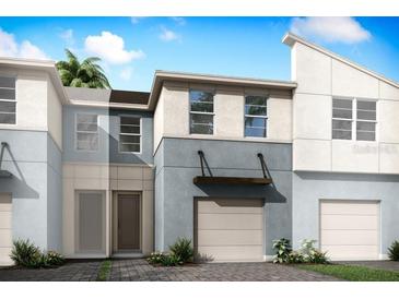 Modern two-story townhome with attached garage and neutral color palette at 3234 Sunrise Spring Pl, Brandon, FL 33511