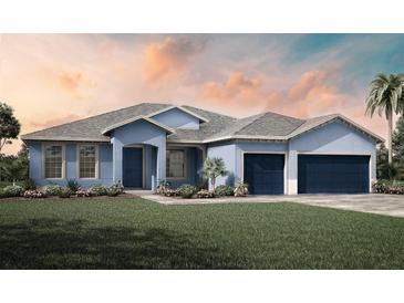 Two-story home with gray roof and blue exterior at 9024 Evelyn Rd, Englewood, FL 34224
