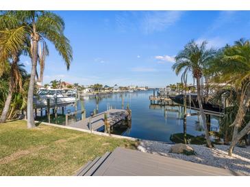 Private dock with boat slips, offering convenient water access at 475 Island Way, Clearwater Beach, FL 33767
