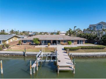 Bird's eye view of waterfront home with private dock and pool at 15 Marina Ter, Treasure Island, FL 33706
