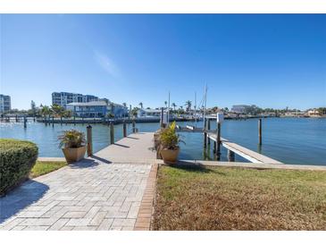 Beautiful waterfront home featuring a private dock with boat lift, perfect for enjoying the Florida lifestyle at 15 Marina Ter, Treasure Island, FL 33706