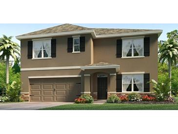 Two-story house with brown exterior, dark shutters, and a two-car garage at 3503 Thistle Bank Ct, Plant City, FL 33565