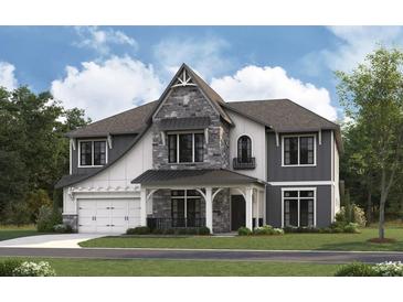 Stunning two-story home with stone accents and a three-car garage at 3509 W Leona St, Tampa, FL 33629