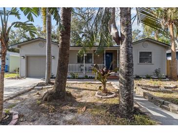 Charming house with a covered porch and well-maintained landscaping at 3620 Queen N St, St Petersburg, FL 33713