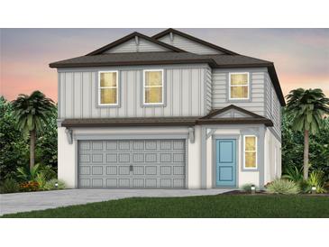 Two-story house with gray siding, a two-car garage, and a light blue front door at 9803 Crescent Moon Dr, Riverview, FL 33578