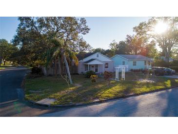 Cute two-bedroom house with a large front yard and a detached garage at 4700 18Th N Ave, St Petersburg, FL 33713