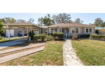 Charming single story home with landscaped yard and walkway at 1453 Turner St, Clearwater, FL 33756