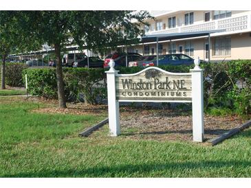 Winston Park NE Condominiums sign in front of building and parking lot at 4915 Bay Ne St # 123, St Petersburg, FL 33703
