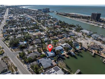 Waterfront property with easy access to the Gulf, a private dock, and a stunning aerial view of the neighborhood at 505 80Th Ave, St Pete Beach, FL 33706