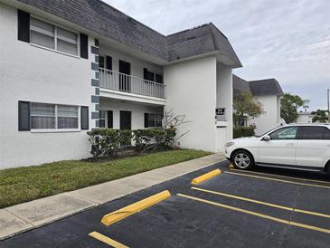 Two-story building exterior with parking and landscaping at 203 47Th Avenue W Dr # 167, Bradenton, FL 34207