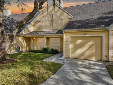 Cute yellow two-story home with a one car garage at 3610 Pine Knot Dr, Valrico, FL 33596