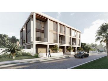 Modern multi-unit building with light-colored facade and private balconies at 2707 N Woodrow Ave # 2, Tampa, FL 33602