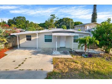 Cute bungalow style home with a carport and well-maintained lawn at 5418 10Th Ave S, Gulfport, FL 33707