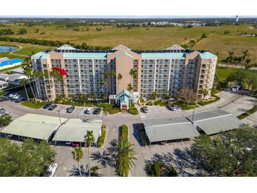 Aerial view of a condominium complex with parking and lush landscaping at 2320 Terra Ceia Bay Blvd # 403, Palmetto, FL 34221