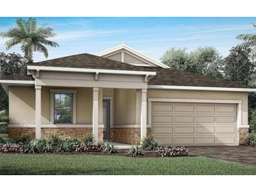 One-story house with light beige siding, stone accents, and a two-car garage at 12348 49Th E St, Parrish, FL 34219