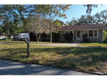 Cute one-story house with a well-maintained lawn at 1149 Sedeeva St, Clearwater, FL 33755