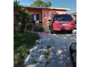 Ranch-style home with a spacious yard and driveway at 5031 S Dr Martin Luther King Jr S St, St Petersburg, FL 33705
