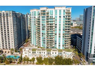 Aerial view of a modern high-rise condominium building with balconies and city views at 450 Knights Run Ave # 1102, Tampa, FL 33602