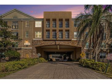 Building exterior featuring a grand entrance and landscaping at 4221 W Spruce St # 2418, Tampa, FL 33607