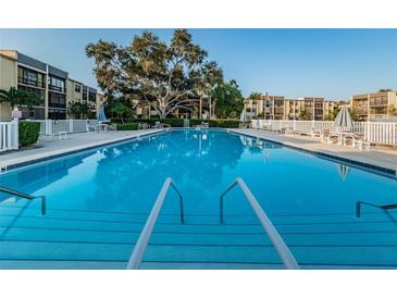 Enjoy the large pool with ample seating and sundeck in this lovely condo community at 14130 Rosemary Ln # 4311, Largo, FL 33774