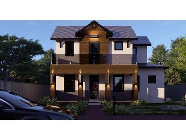 Two-story house with dark wood accents and a glass balcony at 6266 4Th S Ave, St Petersburg, FL 33707