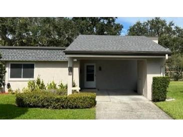 Charming single-story home with a covered carport and manicured landscaping at 2638 Barksdale Ct # 2638, Clearwater, FL 33761