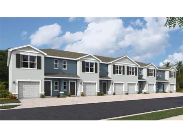 Five-unit townhome building, light blue exterior, two-car garages at 4206 Red Banks Ln, Bradenton, FL 34208