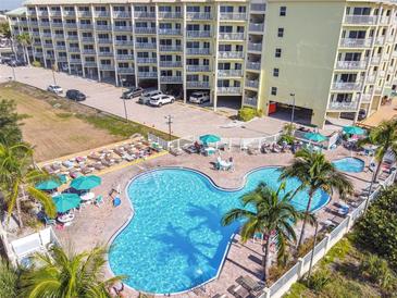 Aerial view of resort showing pool, parking and building at 12000 Gulf Blvd # 212-N, Treasure Island, FL 33706